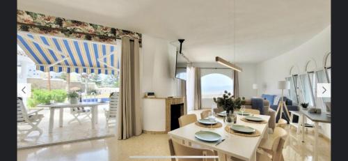 a dining room and living room with a table and chairs at Casa Al Castello - Apartments Buccino in Buccino