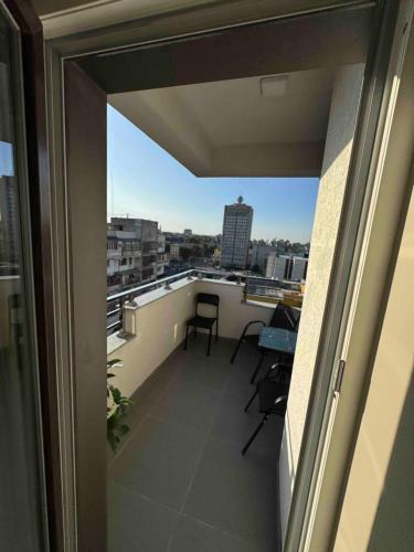 Балкон или терраса в RentNow Modern Business Apartment with 3 Bedrooms in Centre Chișinău