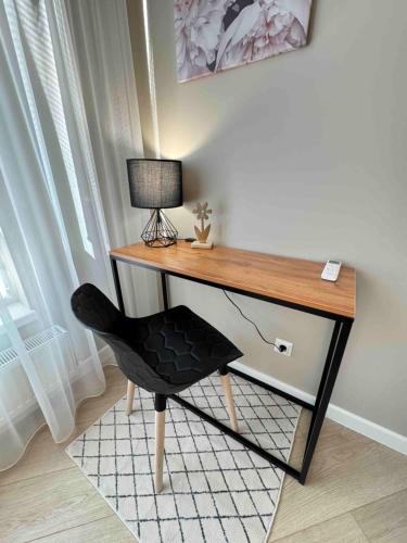 Телевизор и/или развлекательный центр в RentNow Modern Business Apartment with 3 Bedrooms in Centre Chișinău