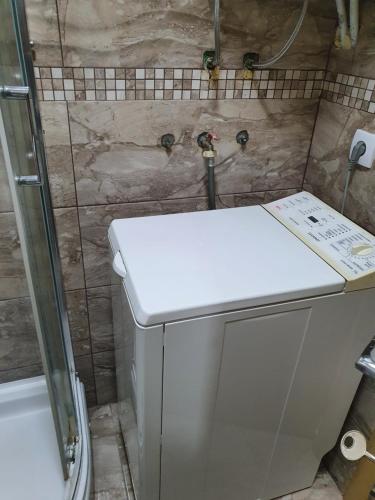 a small bathroom with a toilet and a sink at Beautifull apartmen s3 at nice place in Pančevo