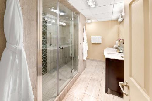 a bathroom with a shower and a sink at Best Western Plus NorWester Hotel & Conference Centre in Thunder Bay