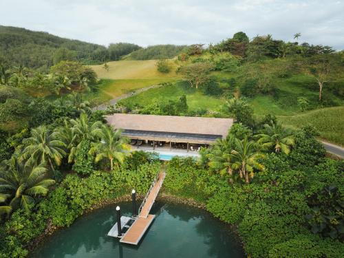 an aerial view of a resort with a bridge over a body of water at Six Senses Fiji in Malolo