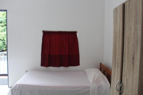 A bed or beds in a room at HIME LODGE