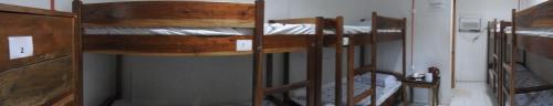 a group of bunk beds in a room at Pacifico Seaside Lodge in Moalboal