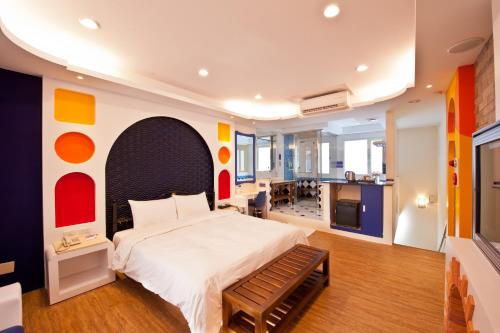 Ένα ή περισσότερα κρεβάτια σε δωμάτιο στο Yudali Motel