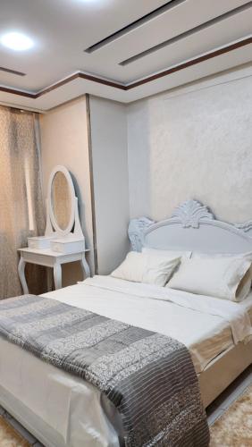 Ένα ή περισσότερα κρεβάτια σε δωμάτιο στο Appartement familial