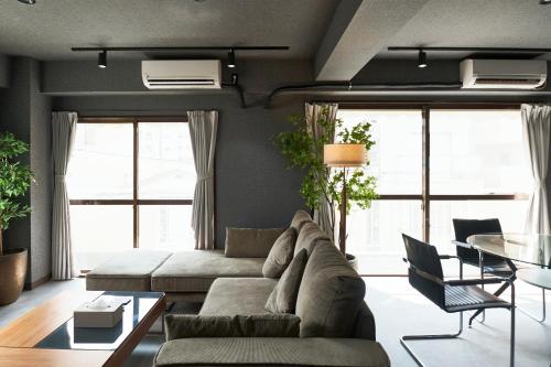 a living room with a couch and a table at Historic Town in the Heart of Tokyo - Easy Access to Attractions in Tokyo