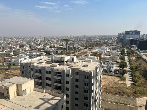 an aerial view of a city with buildings at Three-bedroom Urban Retreat with Terrace AQZ Apartments in Humak