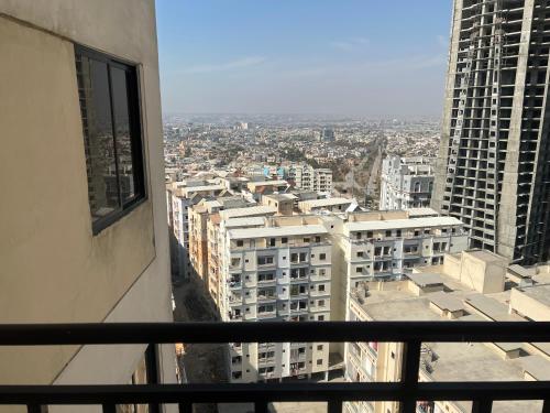 a view of a city from the window of a building at Three-bedroom Urban Retreat with Terrace AQZ Apartments in Humak