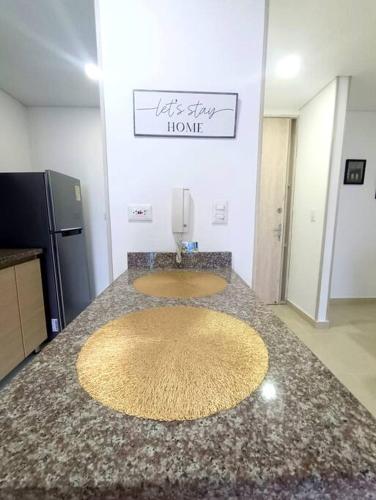 a kitchen with two sinks on a granite counter top at Moderno y central apartamento in Vallecito