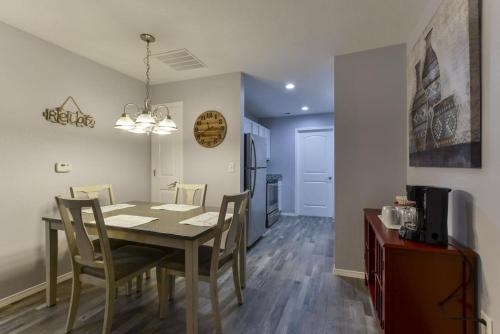a dining room and kitchen with a table and chairs at Western Comfort in Branson