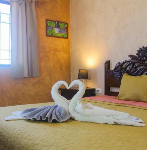 Ένα ή περισσότερα κρεβάτια σε δωμάτιο στο Hotel La Casona Real
