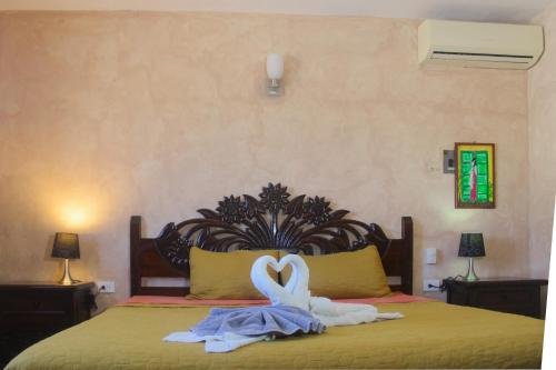 Ένα ή περισσότερα κρεβάτια σε δωμάτιο στο Hotel La Casona Real