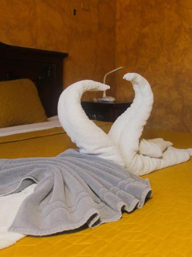 Ένα ή περισσότερα κρεβάτια σε δωμάτιο στο Hotel La Casona Real