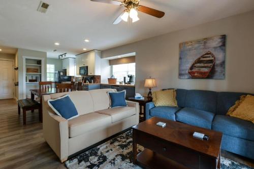 a living room with a white couch and a blue couch at Libby's Perch No Stairs Outdoor Pool in Branson
