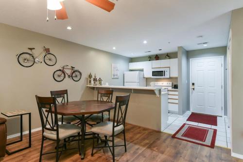 a kitchen and dining room with a table and chairs at Shelter in Faith- Amazing Golf Views in Branson