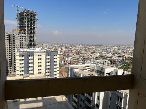 a view of a city from a window in a building at Three-bedroom Urban Retreat with Terrace AQZ Apartments in Humak