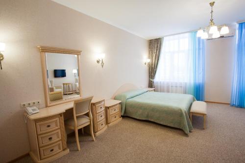 Voodi või voodid majutusasutuse Hotel Avrora toas