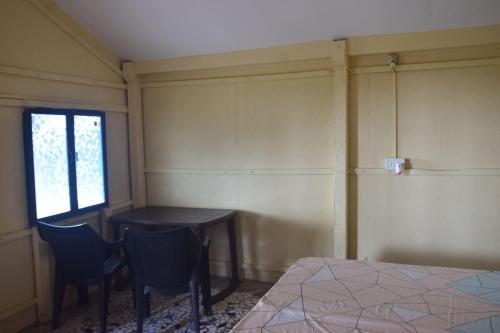 Ein Bett oder Betten in einem Zimmer der Unterkunft Castello's Coco Huts