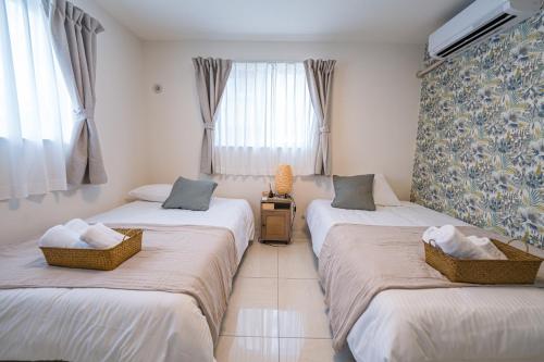 Katil atau katil-katil dalam bilik di Guest House Terrace