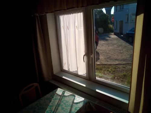 a window with a view of a street at Zur Schlinge in Siebenhitz