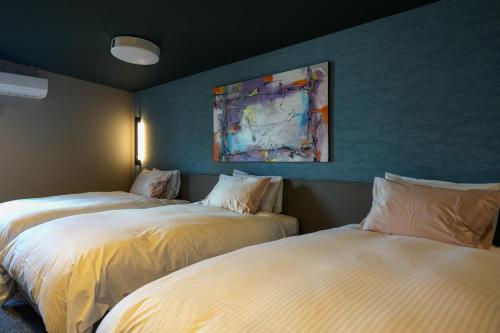 Villa 石の蔵 Hotelにあるベッド