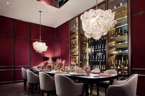 a dining room with a long table and chairs at The St. Regis Mexico City in Mexico City
