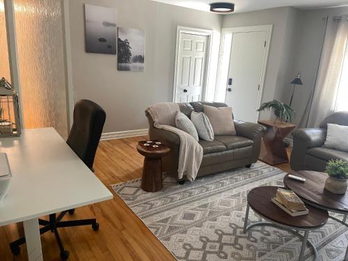 a living room with a couch and a table at University Manor in Moncton