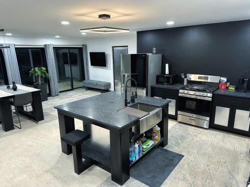 a kitchen with a island in the middle of it at High Plains Hideaway in Colby