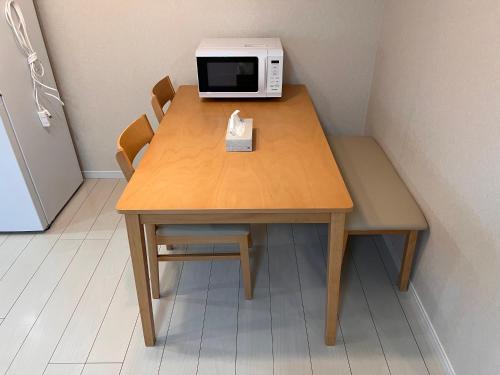 Η κουζίνα ή μικρή κουζίνα στο Check in is available from 12 PM Yokkaichi Miyamadocho House A