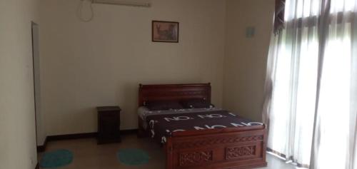 Ένα ή περισσότερα κρεβάτια σε δωμάτιο στο Nil Diya Villa