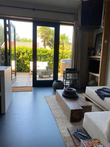 a living room with a couch and a table at POLDER aan de Zeeuwse kust in Wemeldinge