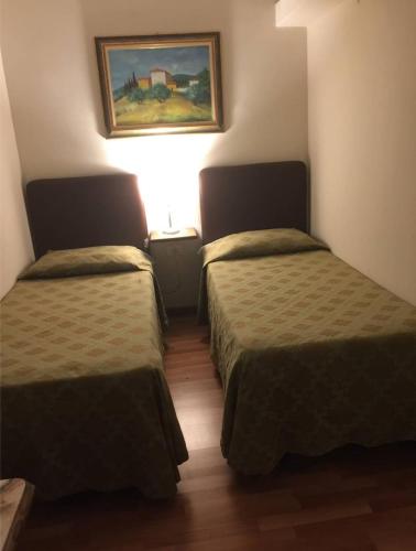 Ένα ή περισσότερα κρεβάτια σε δωμάτιο στο Hotel Lago Verde