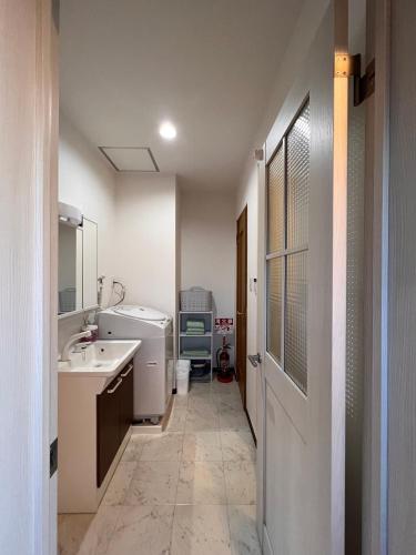 a bathroom with a sink and a toilet in it at Check in is available from 12 PM Yokkaichi Miyamadocho House B in Yokkaichi