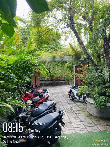 a row of scooters parked in a courtyard at Romo Homestay in Quang Ngai