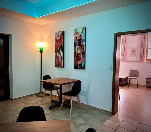 a dining room with a table and chairs at BenDorma in Hannover