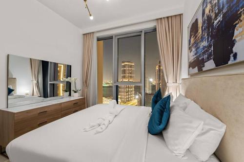 Llit o llits en una habitació de FIRST CLASS 1BR Urban Chic Oasis