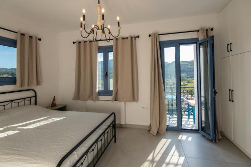 Postel nebo postele na pokoji v ubytování AEGEAN HORIZON villa