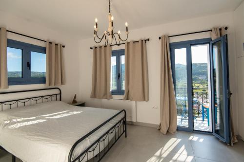 Postel nebo postele na pokoji v ubytování AEGEAN HORIZON villa