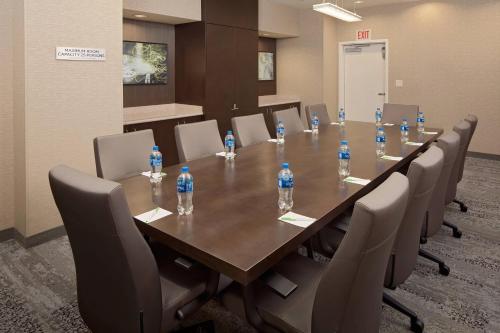 a conference room with a table with bottles of water on it at Courtyard by Marriott Houston Medical Center/NRG Park in Houston