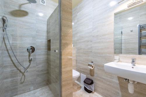 a bathroom with a shower and a sink at Premium hotel & SPA in Bukovel