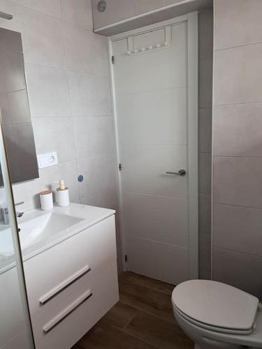 a bathroom with a toilet and a sink and a shower at Design seaview flat next to Yumbo in Playa del Ingles