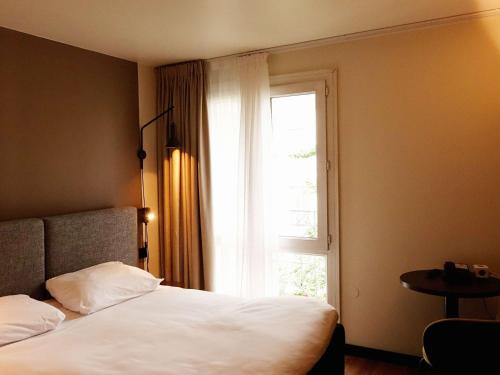 Postel nebo postele na pokoji v ubytování ibis Lille Centre Grand Place