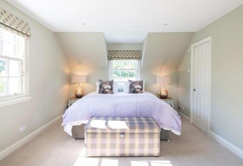 a bedroom with a large bed with two dogs on it at Secluded Luxury Off-Grid Hideaway with Apartment in Selkirk