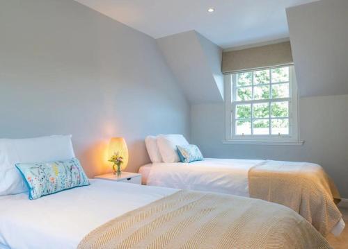 a bedroom with two beds and a window at Secluded Luxury Off-Grid Hideaway with Apartment in Selkirk