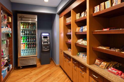 a grocery store aisle with a soda vending machine at La Quinta Inn by Wyndham Sheboygan in Sheboygan