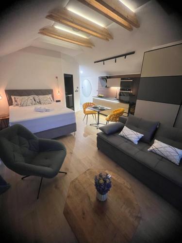 a large living room with a bed and a couch at NOVA LUXURY DESIGN in Zagreb