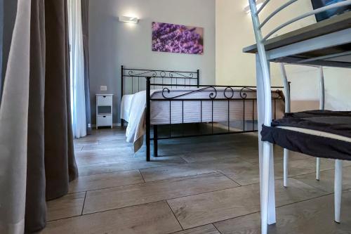 Ένα ή περισσότερα κρεβάτια σε δωμάτιο στο VILLA FENIX OSIO SOTTO 2