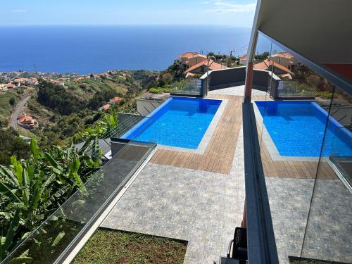 an image of a house with two swimming pools at Villa Diogo in Ponta do Sol