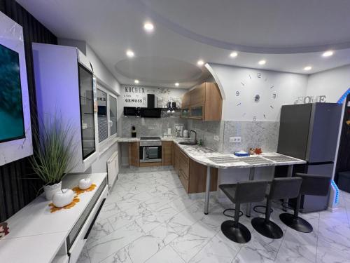 a kitchen with a large island in the middle at Viktor Deluxe in Gotha
